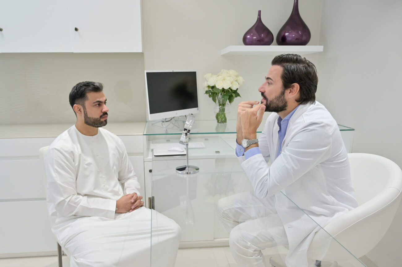 A doctor and a patient talking about dermal filler Dubai