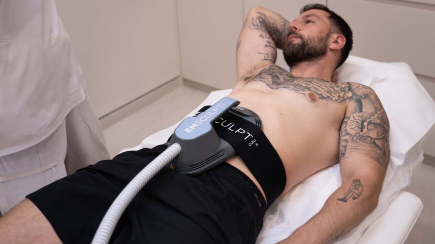 A man getting Emsculpt NEO treatment