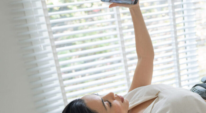 A woman holding a phone