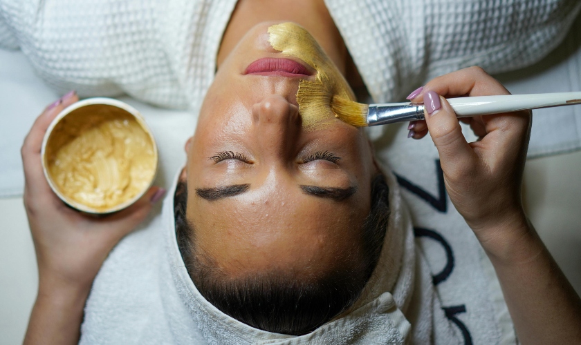 Woman getting a facial mask