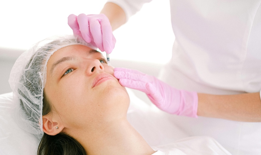 Woman getting a face injection 