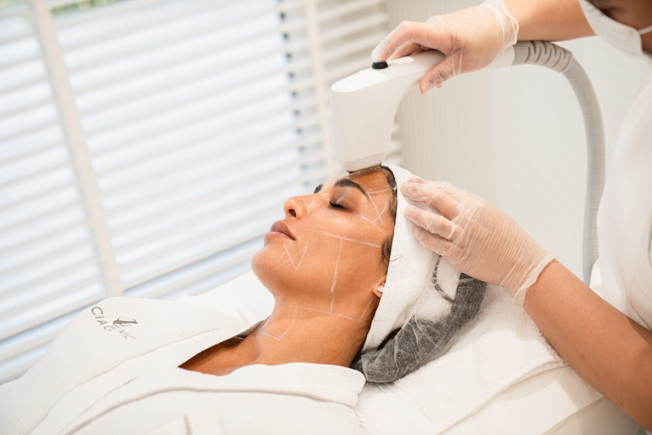 A woman getting Kardashian-level radiance with Sofwave