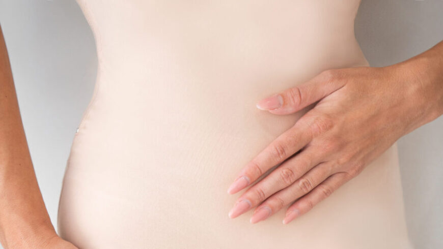 A woman with flat stomach after a liposuction