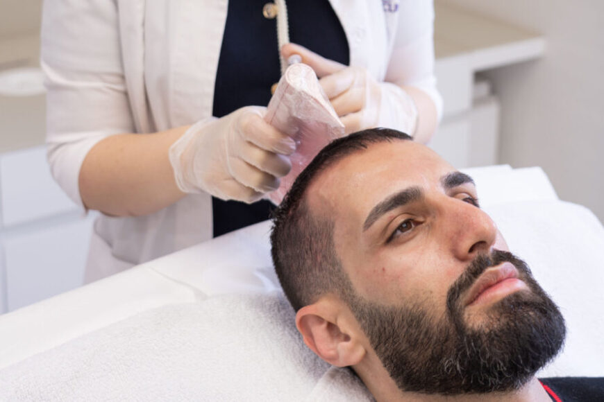 A man getting a hair loss treatment
