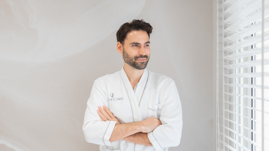 A confident male patient at Lucia Clinic during gynecomastia surgery recovery